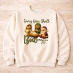 Every Knee Shall Bow Christmas Sweatshirt featuring nativity scene design with soft colors.