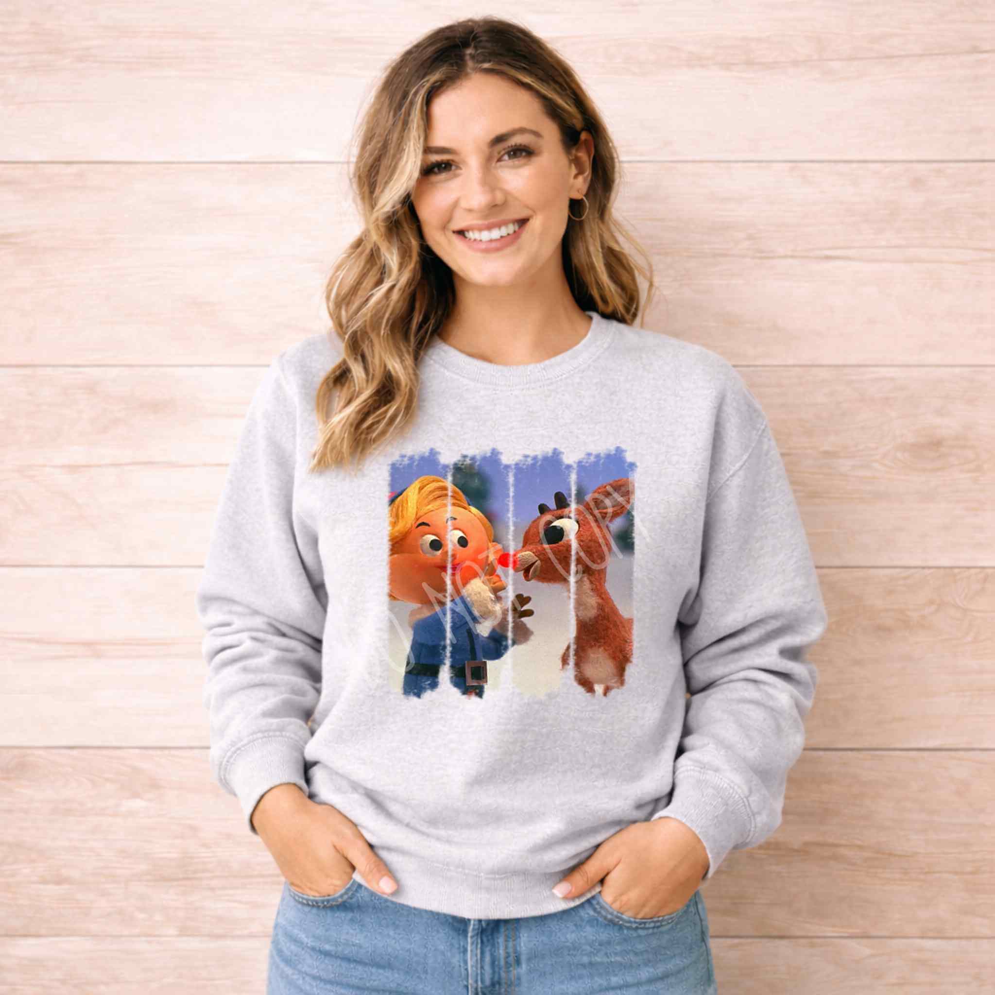 Christmas Elf & Reindeer Sweatshirt featuring a charming elf and reindeer design, perfect for the holiday season.