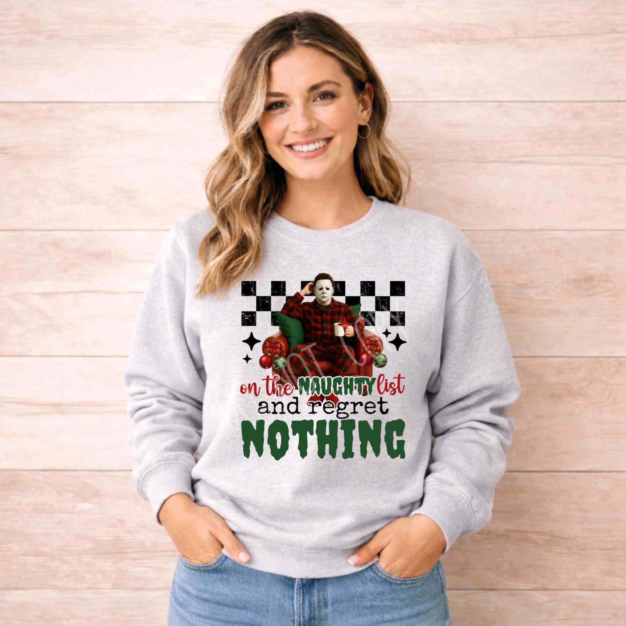 Naughty List Christmas Sweatshirt Holiday Fun and Comfort worn by a smiling woman with a festive design.