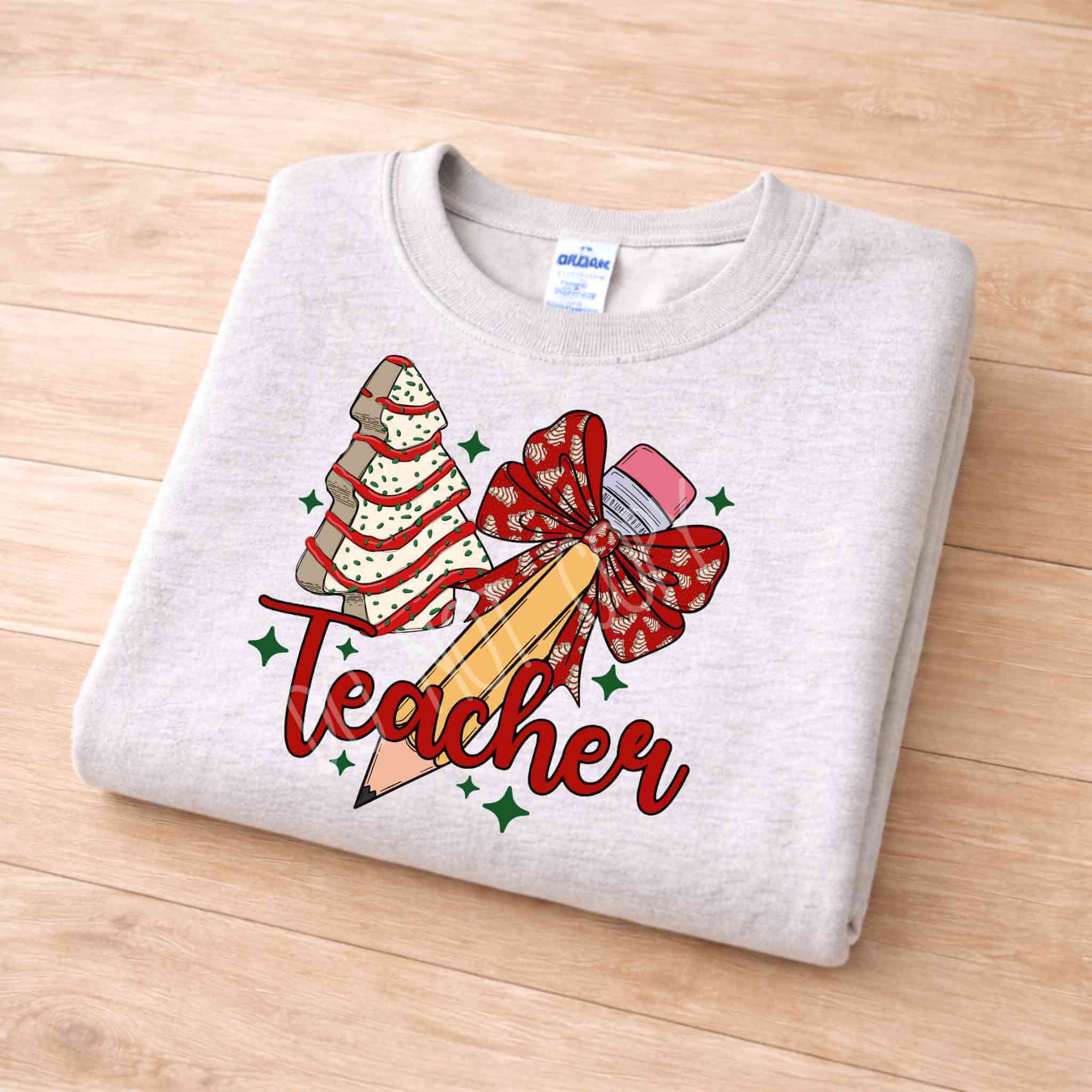 Teacher Christmas Sweatshirt Holiday Comfort and Style with festive pencil, bow, and Christmas tree design.