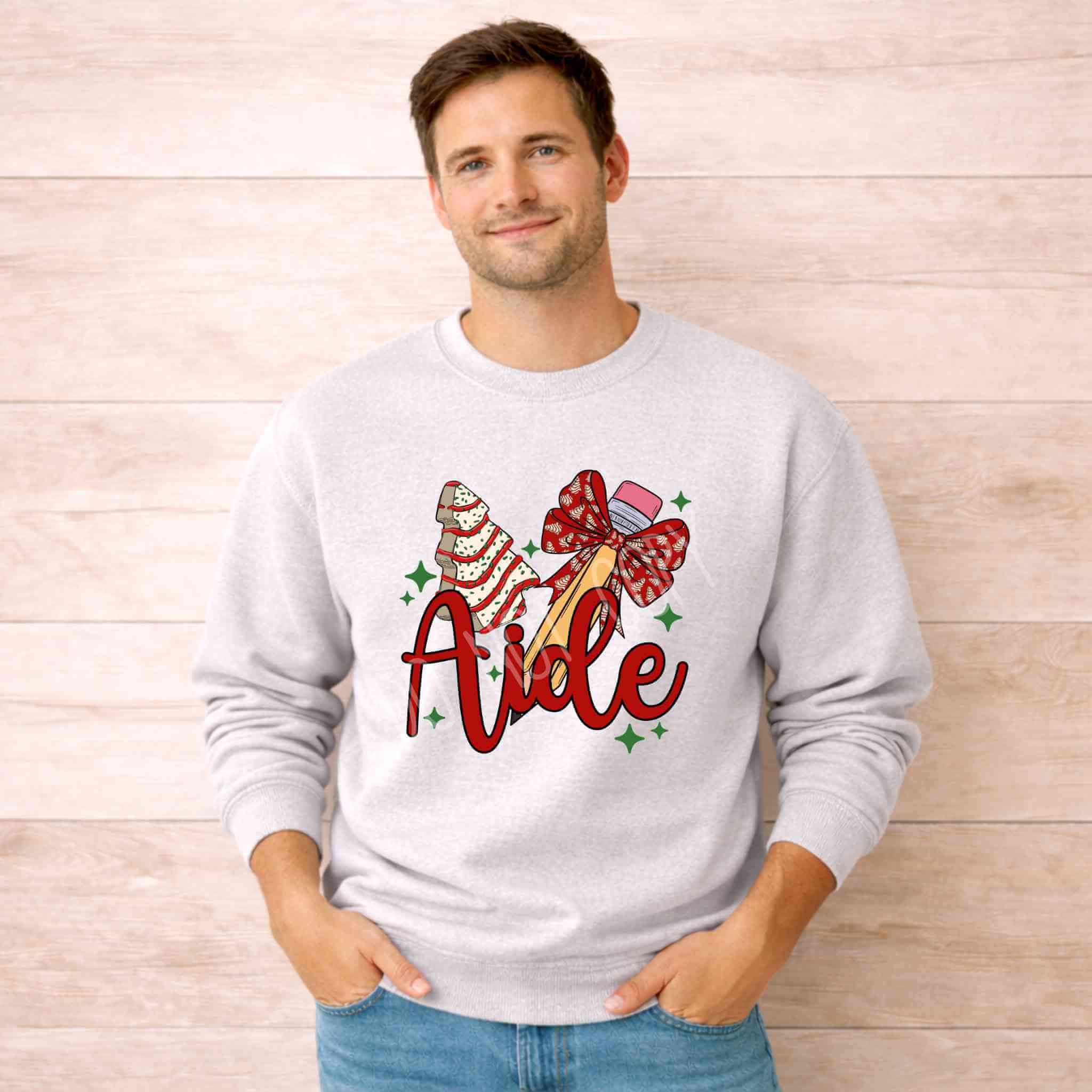 Teacher Aide Christmas Sweatshirt Holiday Comfort and Style featuring festive graphic and cozy design worn by a smiling man.