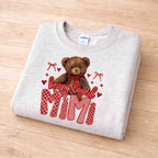 Beary Loved Mama Sweatshirt Comfort Style and Care featuring a teddy bear and Valentine patterns in a cozy design.
