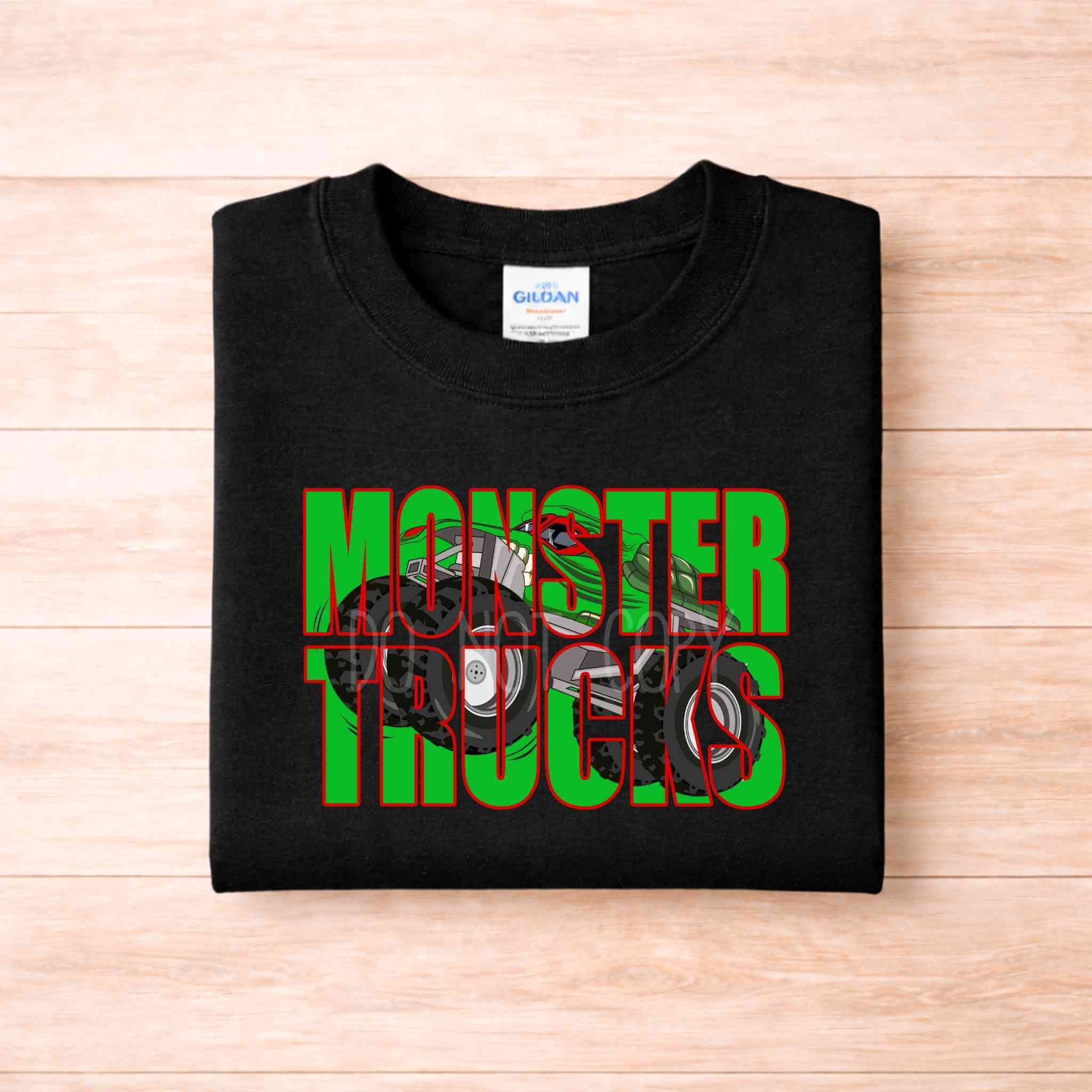 Monster Trucks Youth T Shirt Kids Graphic Tee featuring vibrant green and red design on a black background.