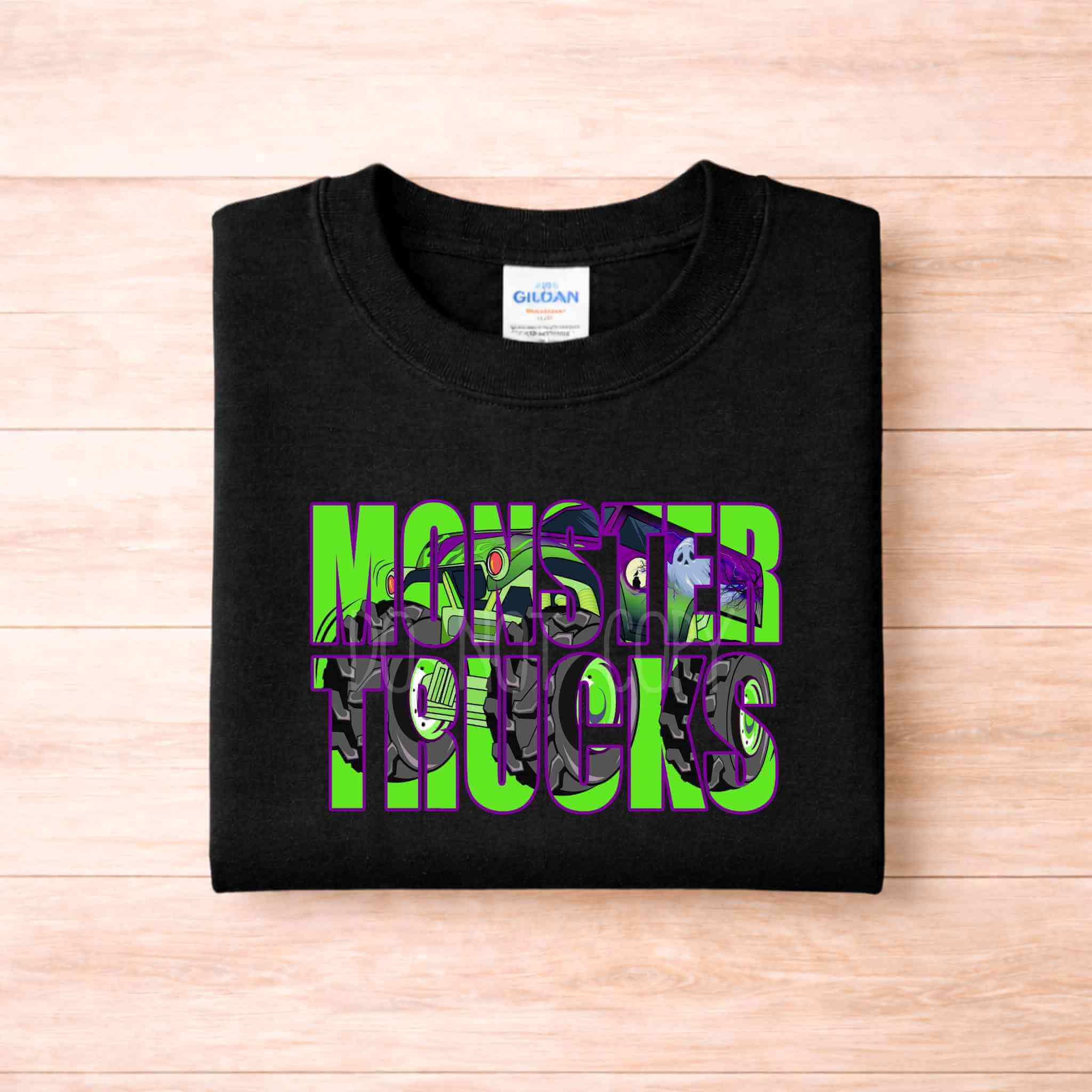 Monster Trucks Youth T Shirt Neon Green Purple Graphic Tee displayed on a black Gildan shirt, featuring vibrant truck graphics.