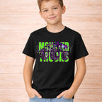 Monster Trucks Youth T Shirt Neon Green Purple Graphic Tee worn by a child, featuring vibrant design on black fabric.