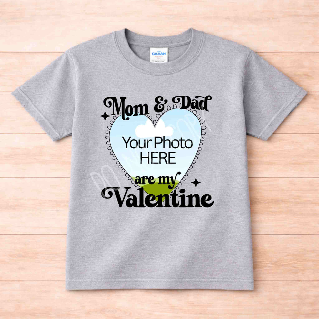 Mom And Dad Are My Valentines Kids T Shirt displayed on a gray background with customizable photo area.