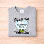 Mom And Dad Are My Valentines Kids T Shirt with customizable photo design on a grey background.
