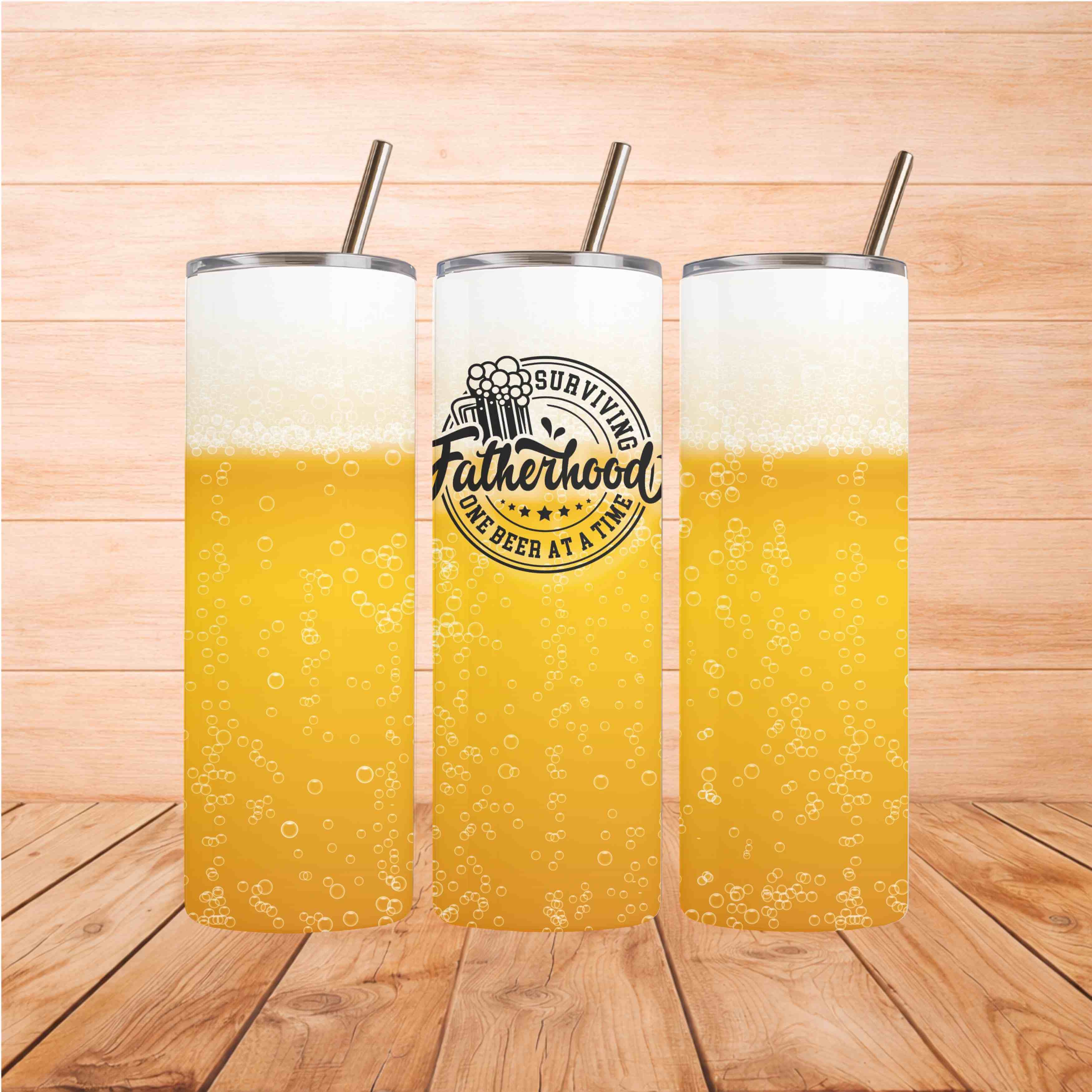 Dad Life Beer Tumbler with frothy beer design and straw on wooden background.