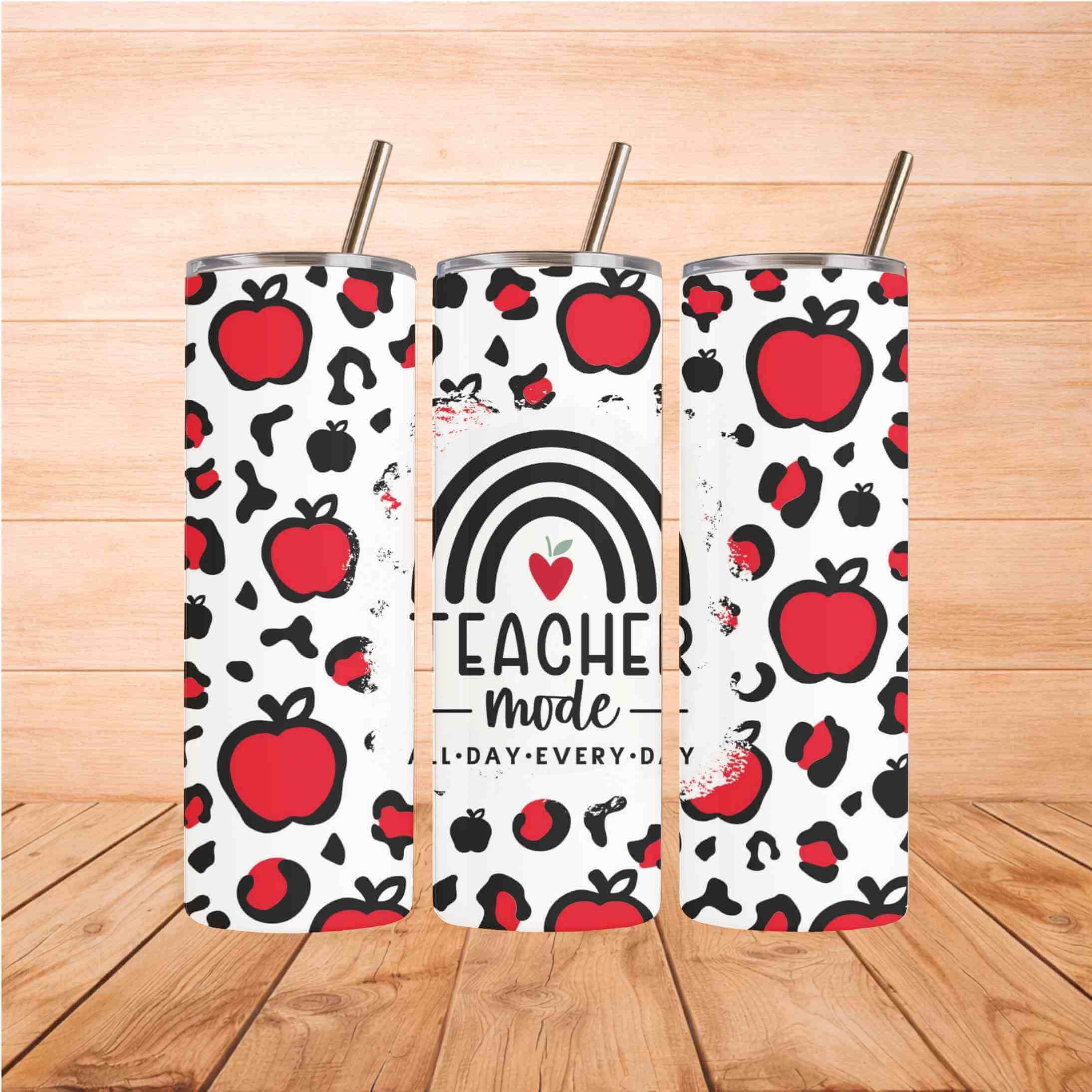 Teacher Mode 20oz Tumbler Durable and Inspiring design featuring red apples and a colorful rainbow.