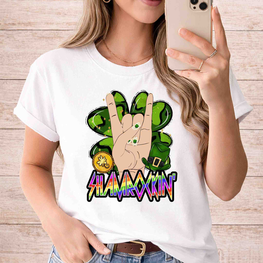 St Patricks Day Shamrockin’ Shirt featuring a vibrant rock sign graphic with shamrock elements and festive colors.