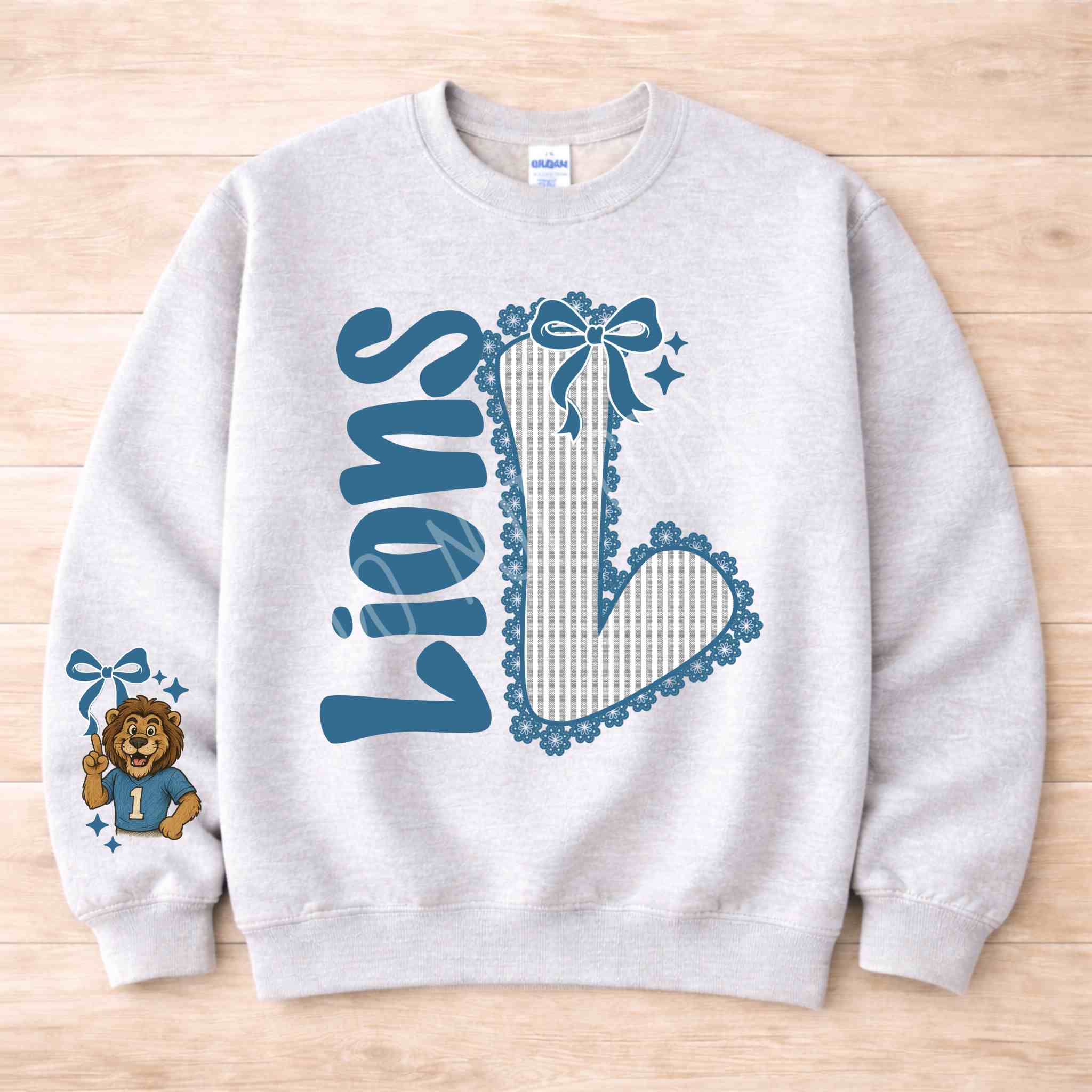 Lions School Spirit Sweatshirt featuring a bold varsity 'L' and cute bow detailing, perfect for showing school pride.