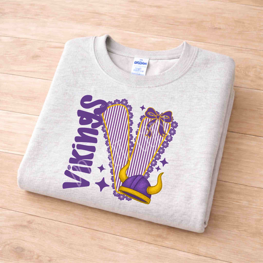 Vikings School Spirit Sweatshirt featuring purple varsity lettering and feminine bow detail on a gray background.