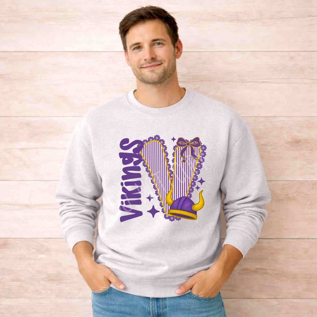 Vikings School Spirit Sweatshirt with varsity design and bow accent worn by a man.