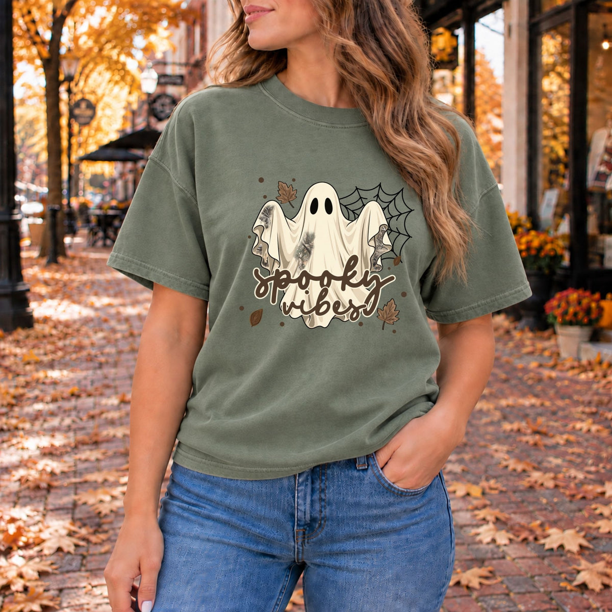 Olive green Halloween graphic tee with spooky ghost and bats print