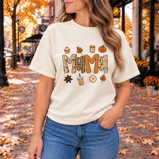 Off-white graphic tee with large MAMA lettering, pumpkins, and fall treats