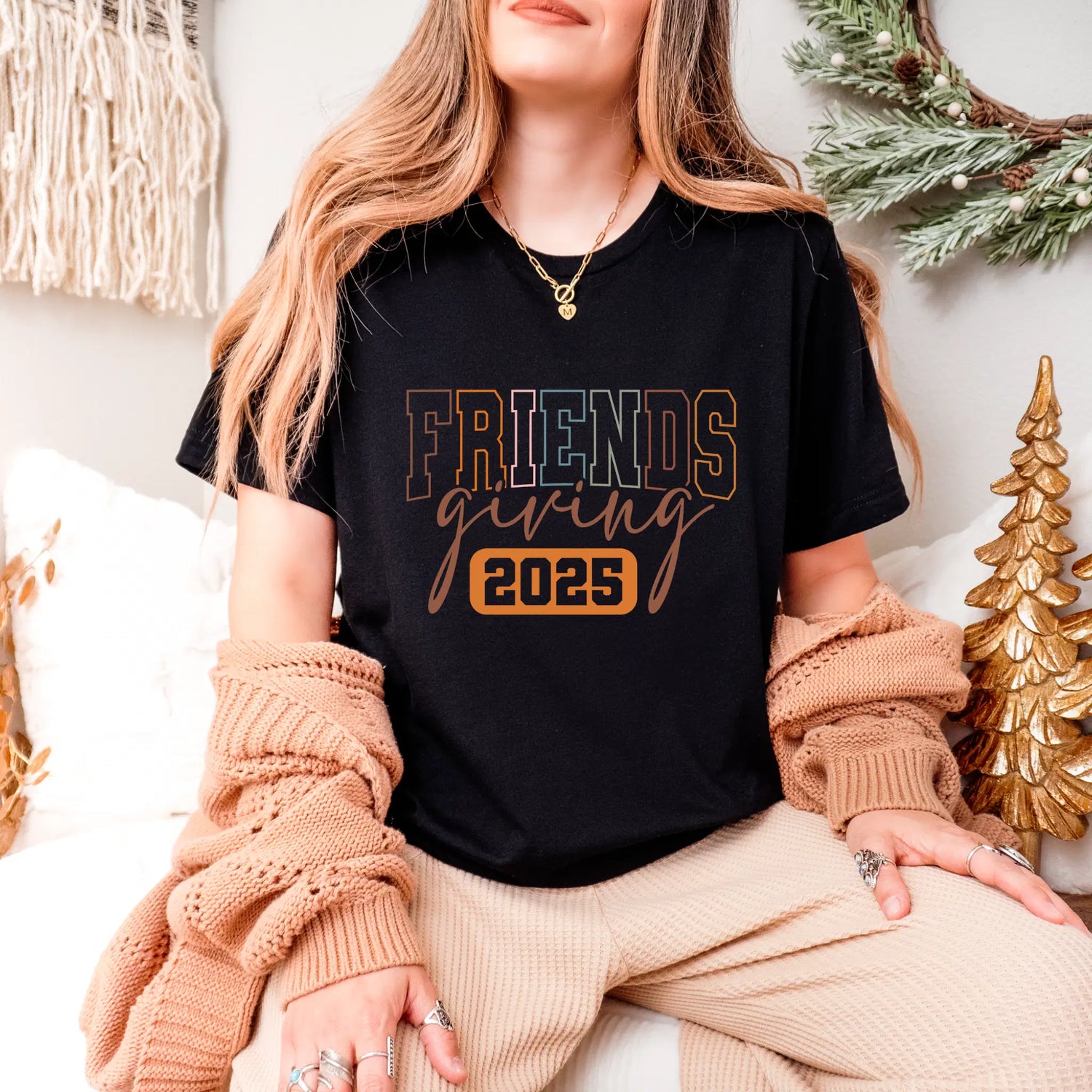 Friendsgiving 2025 T-Shirt: Stylish apparel for Friendsgiving celebrations in 2025, shown on a model wearing cozy attire.