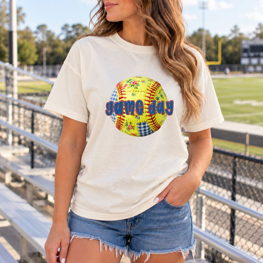Cream softball tee with a floral softball and Game Day lettering
