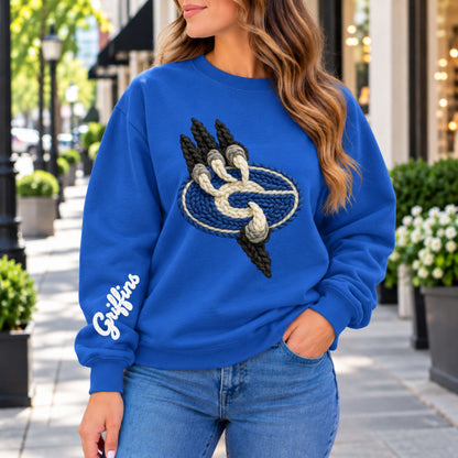 Blue crewneck sweatshirt with front griffin house emblem and white logo on left sleeve