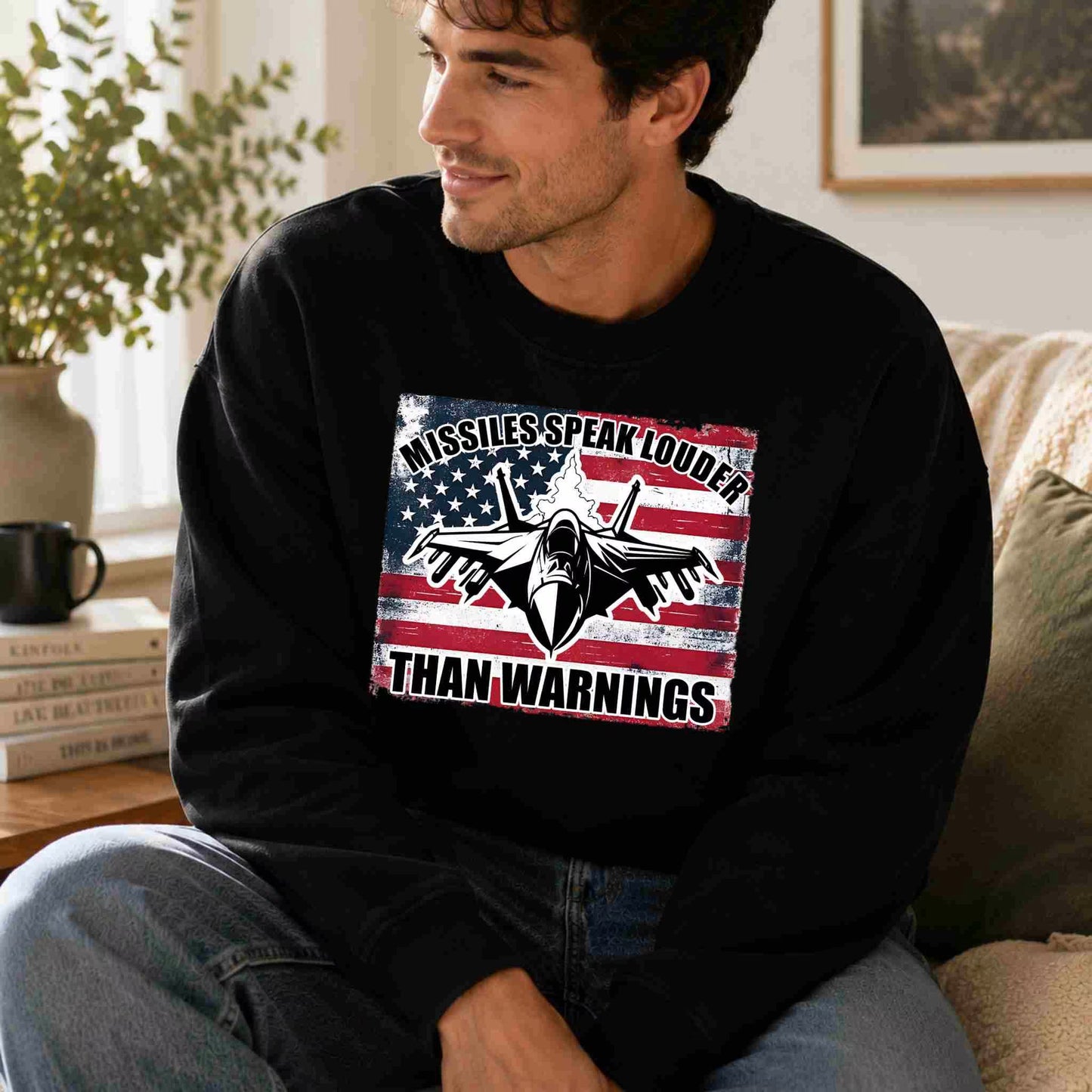 Man wearing a black sweatshirt with a graphic design featuring an American flag and text.