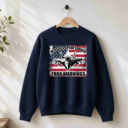 Navy blue sweatshirt with graphic design on a hanger against a white wall.