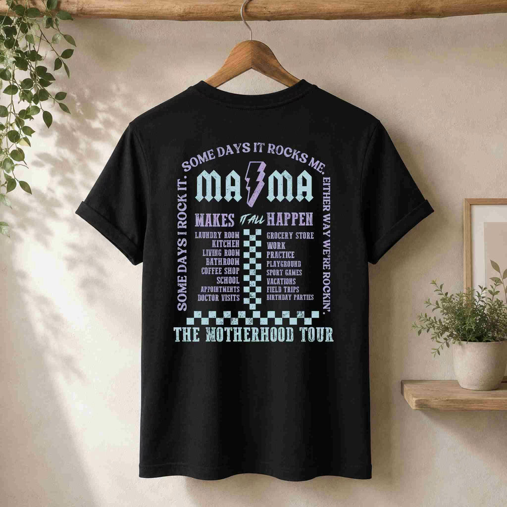 Black t-shirt with text and graphic on a hanger against a neutral wall.