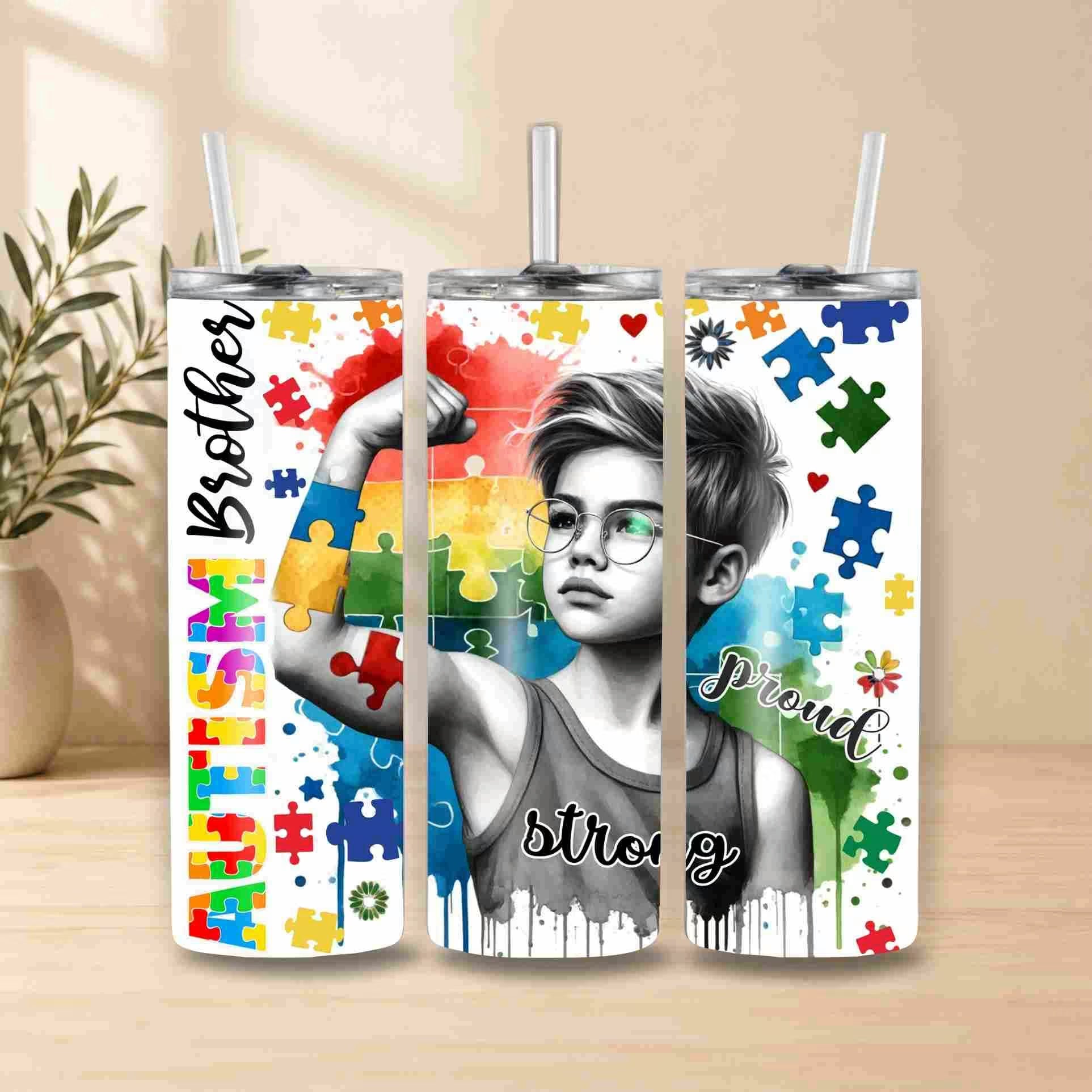 Three tumblers with a design featuring a child, colorful puzzle pieces, and text on a wooden surface.