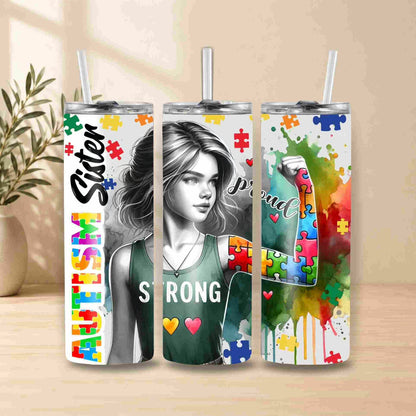 Three tumblers with colorful designs and text on a wooden surface.