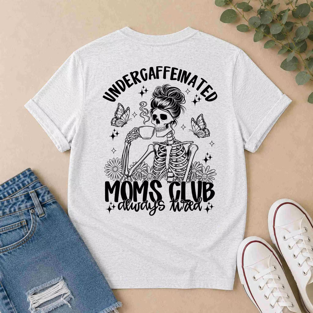 The Undercaffeinated Moms Club Shirt by Becca's Banging Designs LLC is a funny tired mom tee featuring “always tired” and a skeleton mom with coffee, butterflies, and flowers—perfect for cute outfits with denim shorts and white sneakers.
