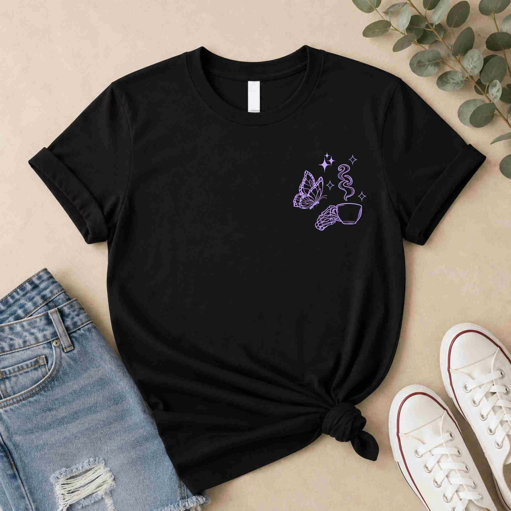 The Undercaffeinated Moms Club Shirt by Becca's Banging Designs LLC is a black women’s graphic tee with a small purple line art butterfly, hand, and stars on the chest—perfect for cute t-shirt outfits.