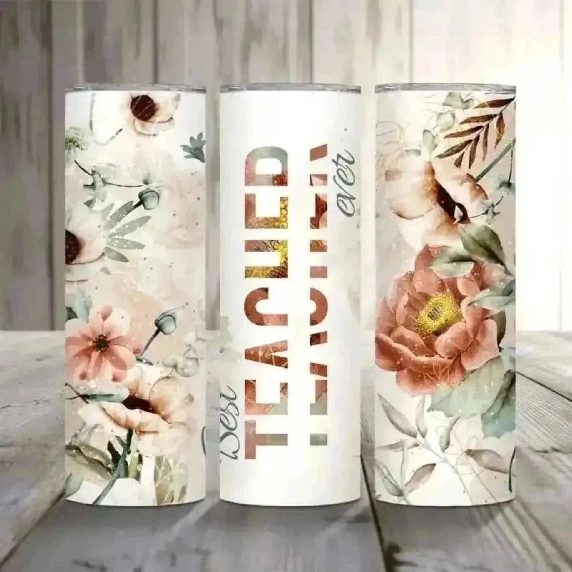 Set of three floral design personalized stainless steel tumblers with "Best Teacher Ever" text for teachers.