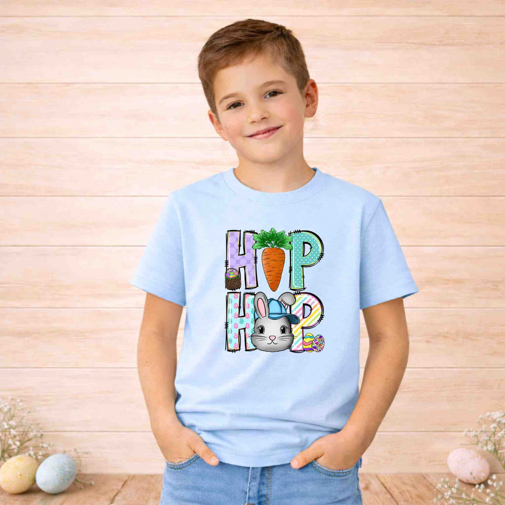 Youth wearing a blue HOP Easter Bunny shirt with carrot and bunny graphic, perfect for spring celebrations.