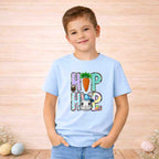 Youth wearing a blue HOP Easter Bunny shirt with carrot and bunny graphic, perfect for spring celebrations.