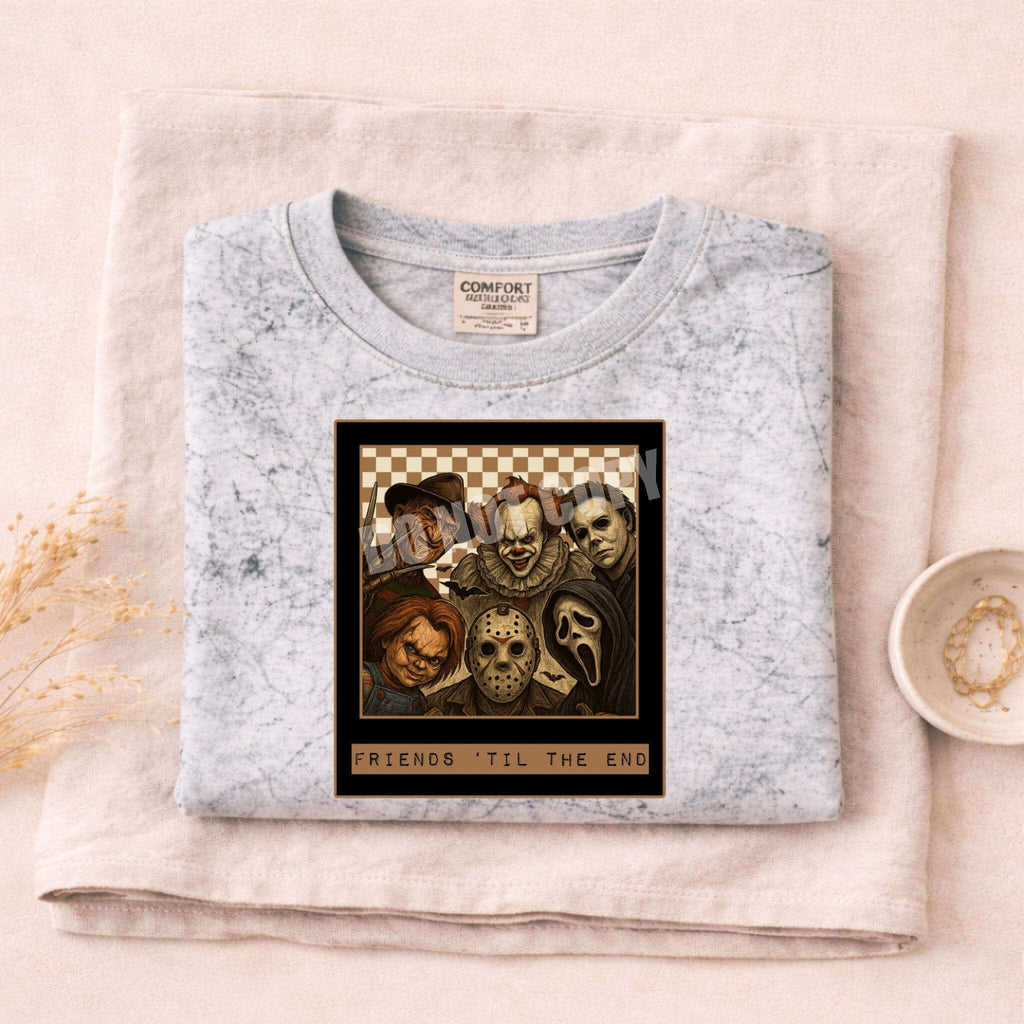 Friends Til The End Horror Villains Tee featuring iconic horror villains on a cozy grey shirt.