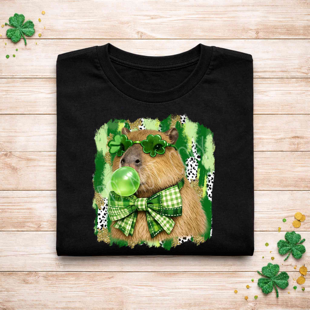 St. Patricks Day Capybara Shirt featuring a cute animal with shamrock glasses and a green bow tie.