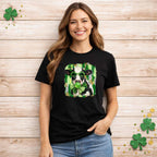 St. Patricks Day Cow Shirt with Shamrock Glasses design worn by a smiling model against a wooden background.