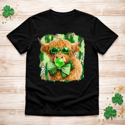 St. Patricks Day Highland Cow Shirt featuring a cow with shamrock glasses and green bow on a black tee.