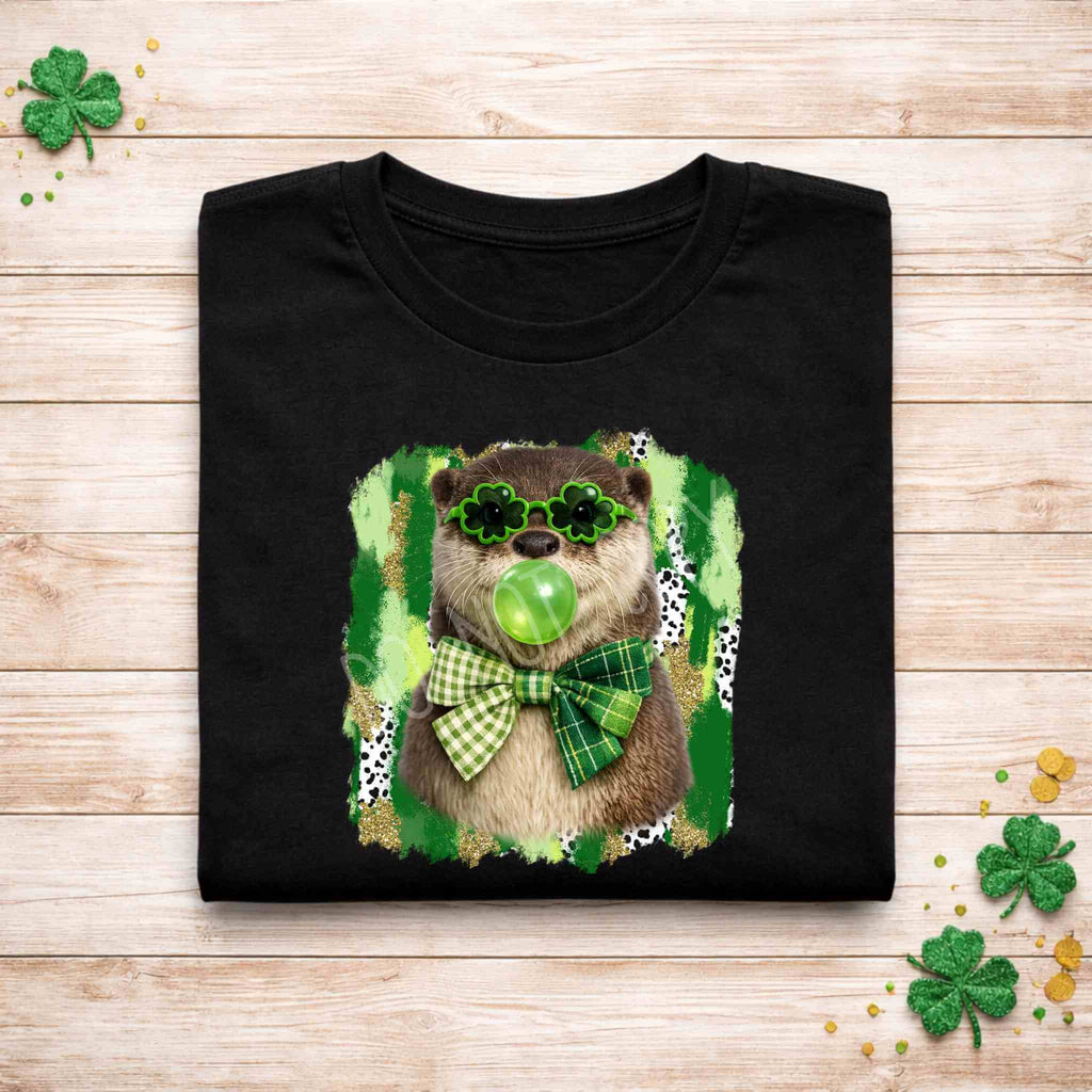 St. Patricks Day Otter Shirt featuring otter in shamrock glasses and green bow on black background.