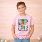 Youth in pink Easter Bunny HOP shirt featuring playful letters and a cute bunny with glasses.