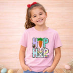 Youth wearing Easter Bunny HOP shirt with bunny and carrot design, perfect for spring celebrations.
