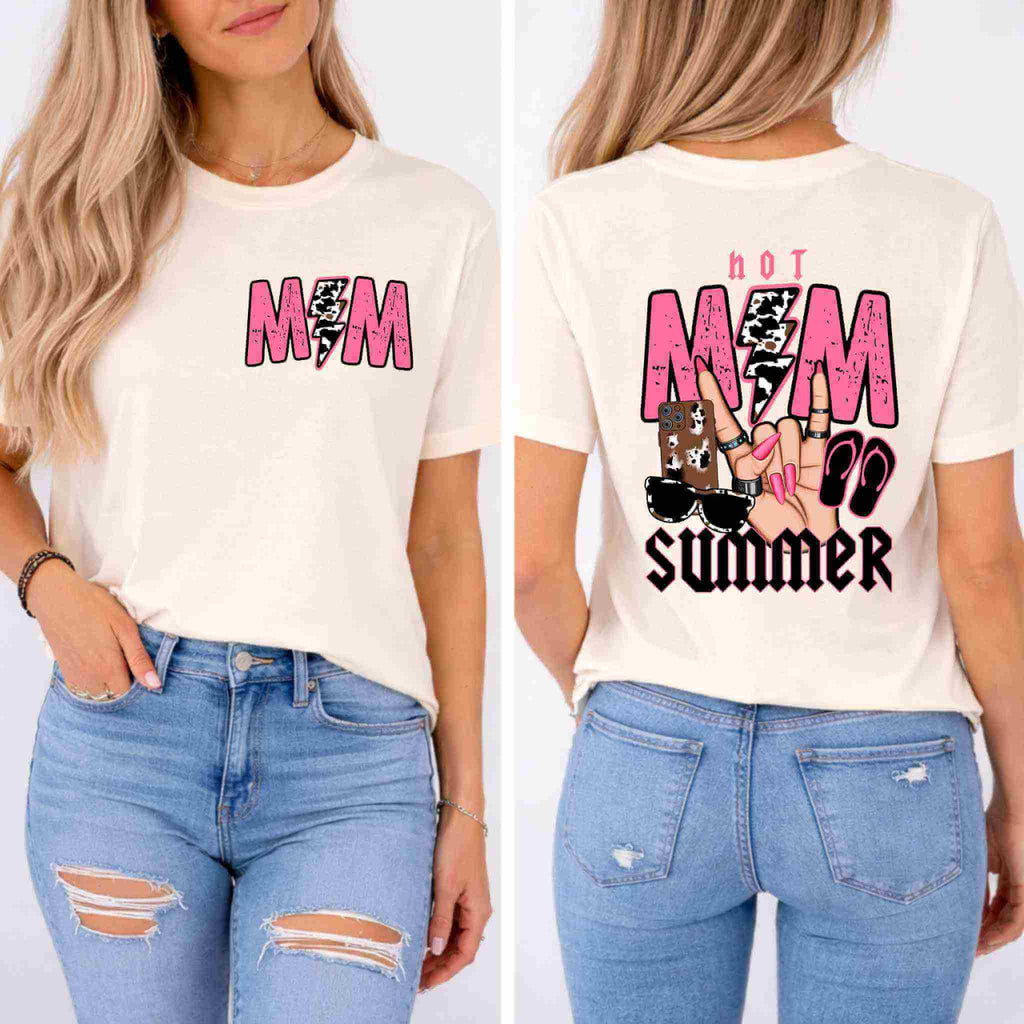 A woman wears the Hot Mom Summer Tee by Becca's Banging Designs LLC—a white women's graphic shirt with MOM in pink and black on the front, Hot MOM Summer and fun summer icons on the back, paired with ripped blue jeans.
