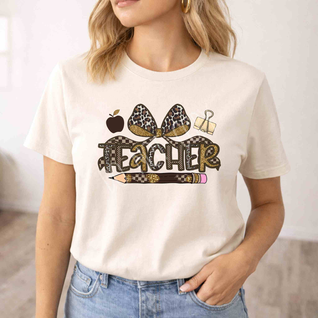 Leopard Love Teacher T-Shirt featuring leopard design, teacher elements, and bow detail.