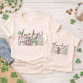 St. Patricks Day T-Shirt Set featuring matching Lucky Mama and Lucky Mini designs in floral and checkered patterns.