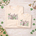 St. Patricks Day matching t-shirt set featuring 'Lucky Mama' and 'Lucky Mini' designs with floral accents.