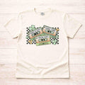 St. Patricks Day shirt featuring a retro cassette graphic with shamrocks and checkered accents.