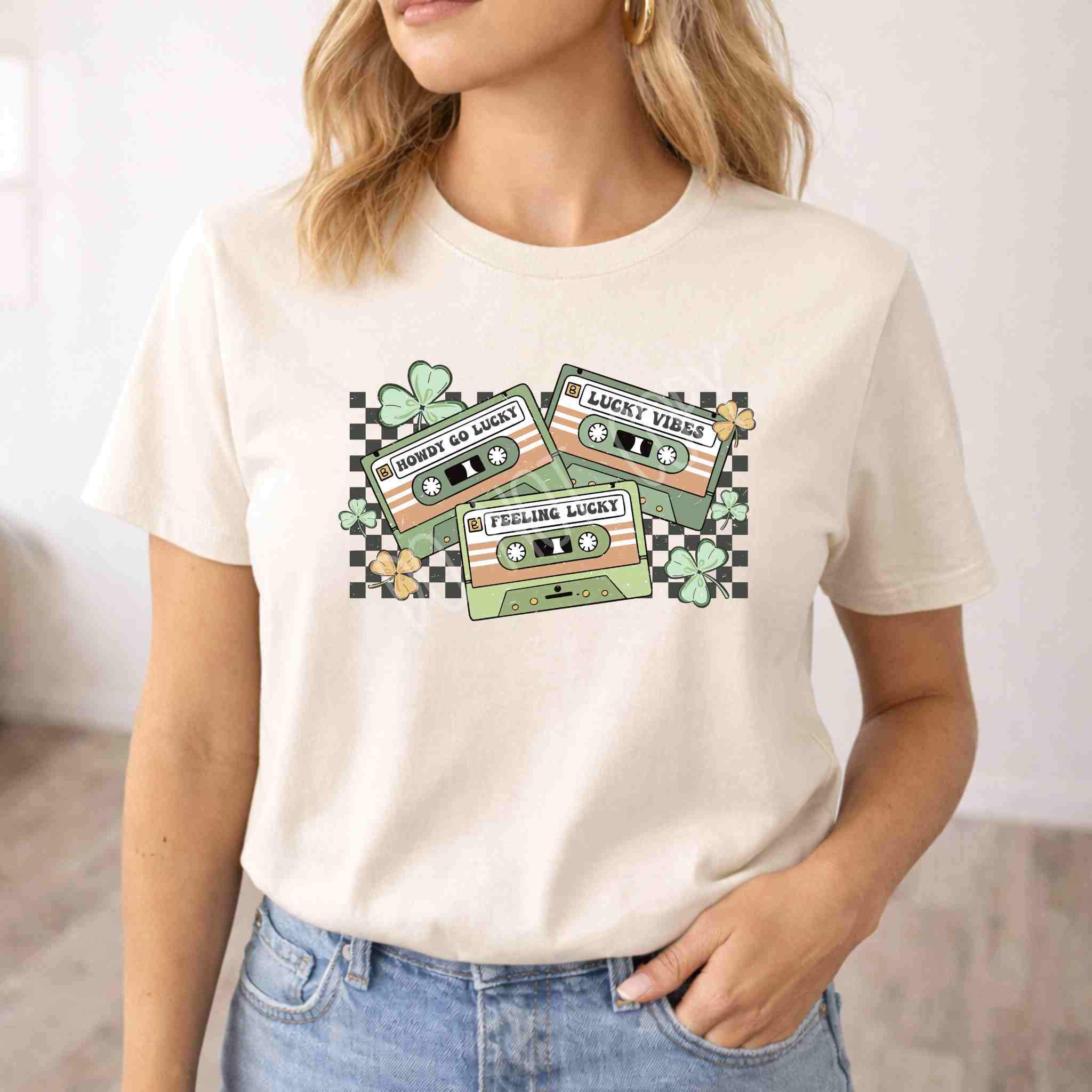 St. Patricks Day shirt featuring retro cassette graphic and shamrock details on a light-colored tee.