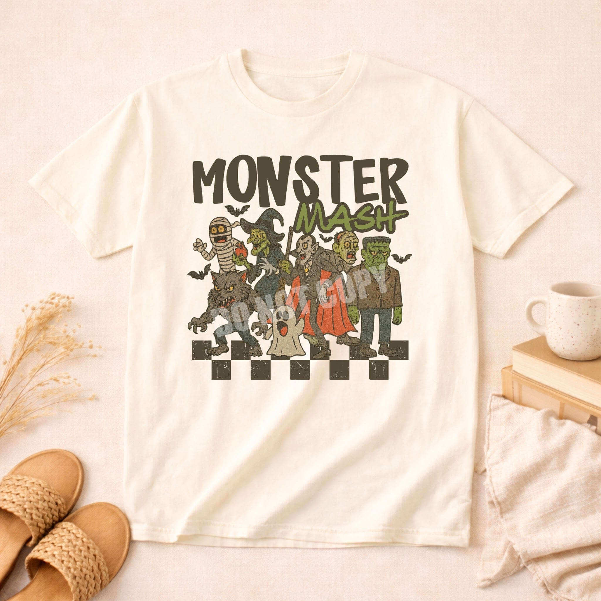 Monster Mash T-Shirt featuring playful Halloween characters in a fun retro design on a light background.