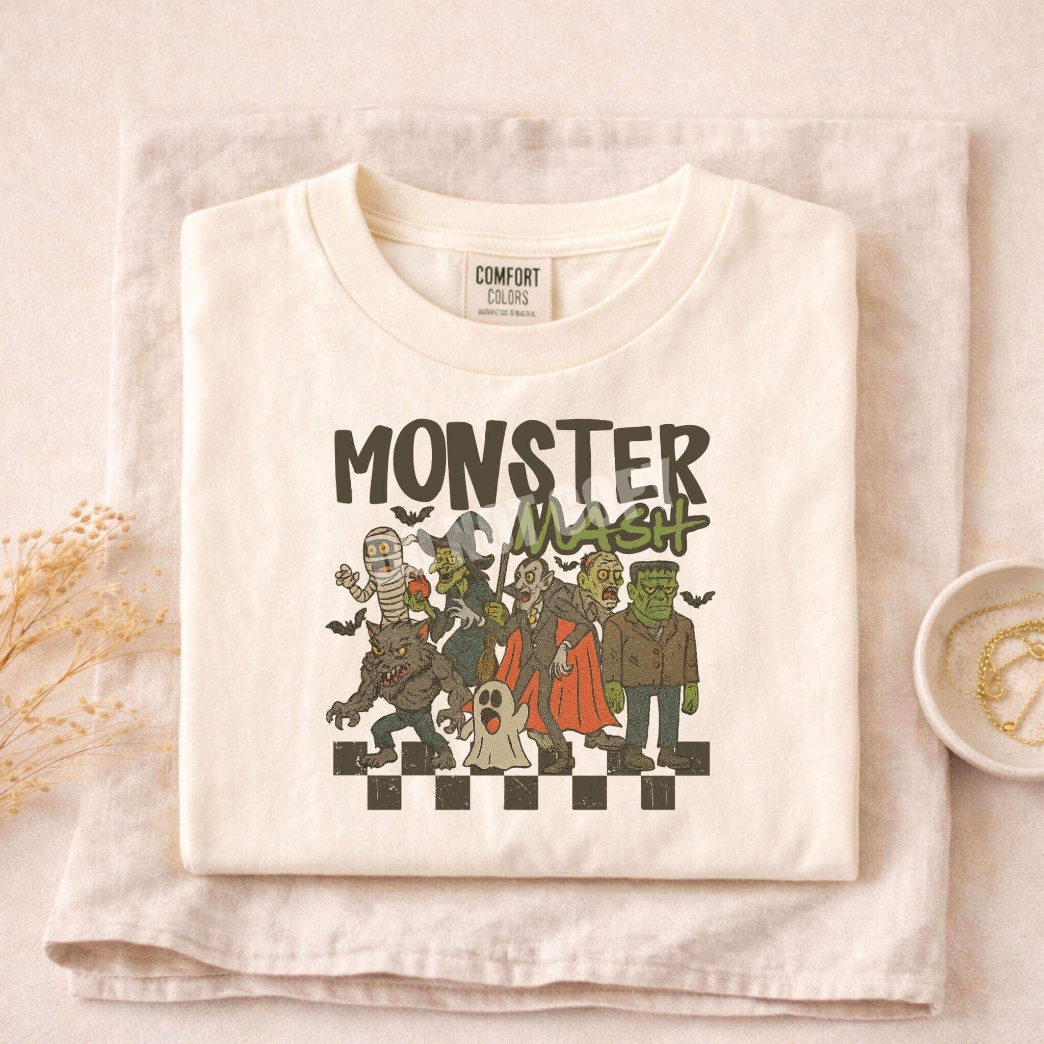 Monster Mash T-Shirt featuring classic Halloween characters in a playful design, perfect for festive celebrations.
