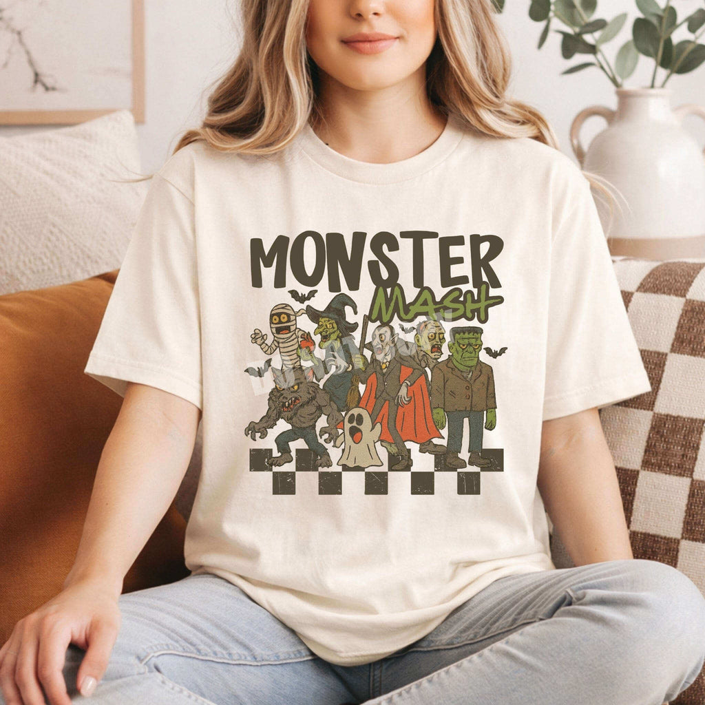 Model wearing Monster Mash T-Shirt featuring retro Halloween characters in a playful design.