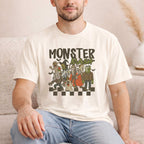 Man wearing a Monster Mash T-Shirt featuring classic Halloween characters in a playful design.
