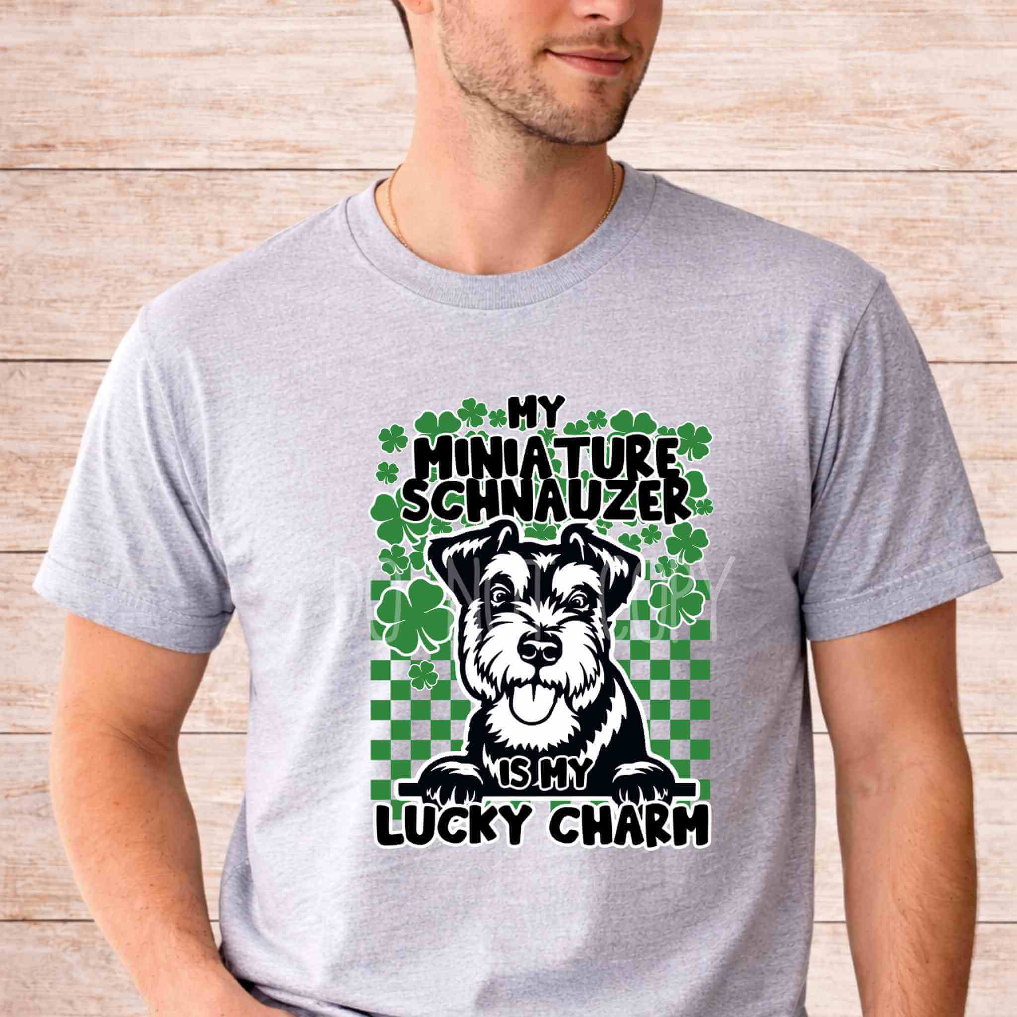 St Patricks Day dog lover shirt featuring a Miniature Schnauzer with clovers and the phrase My Miniature Schnauzer Is My Lucky Charm.